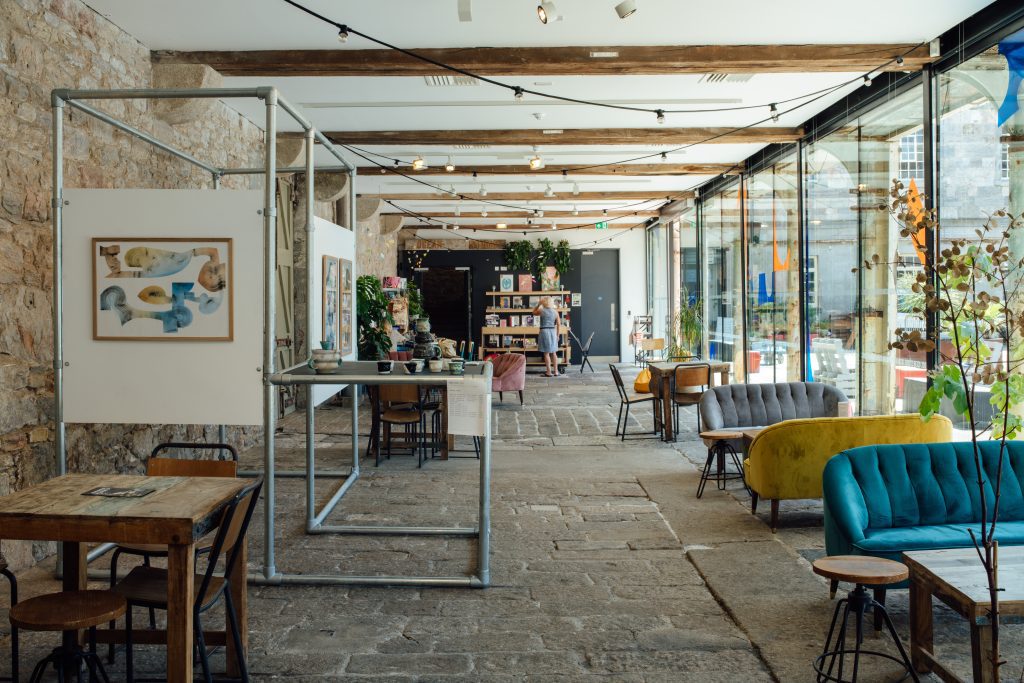 cafe with chairs and exhibition